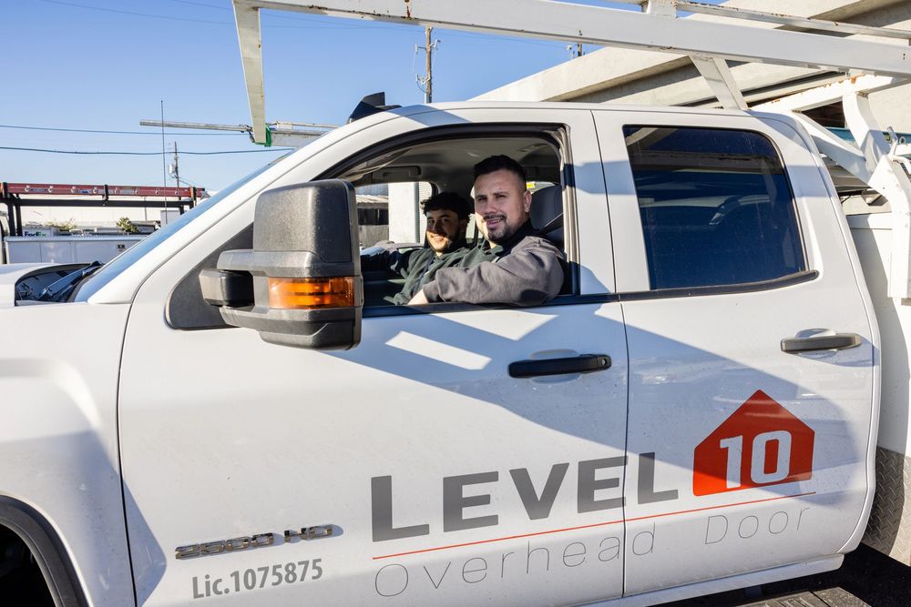 Level 10 Overhead Door technicians in their service truck